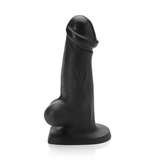 A black Tantus T-rex dildo, a girthy cock with a very pronounced glans and cute little balls at the bottom.