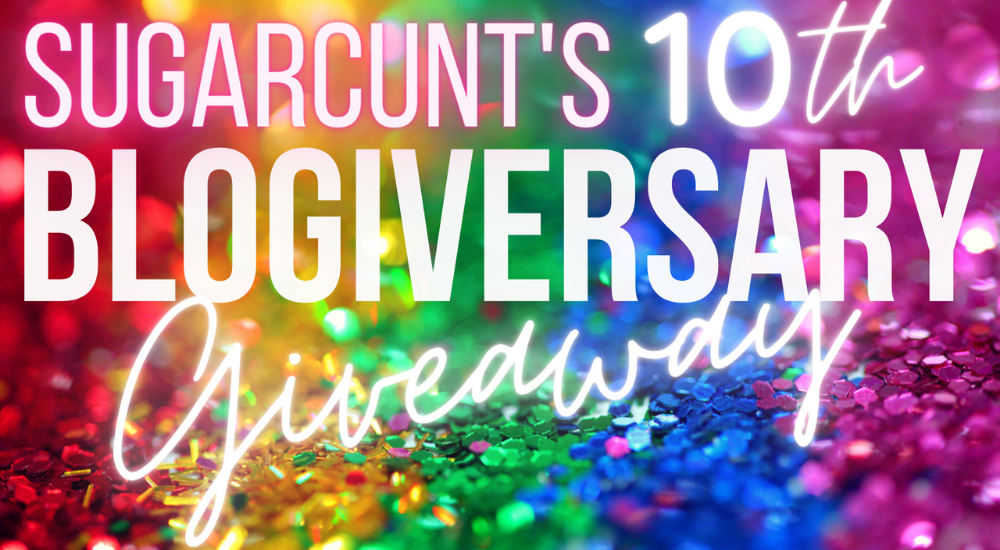A background of sequins, sorted into the colors of the rainbow, is covered by glowing lettings announcing: "Sugarcunt's 10th blogiversary giveaway"